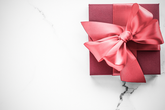 Elegant red gift box, representing thoughtful and heartwarming presents for new mothers curated by Stella Moon Co.