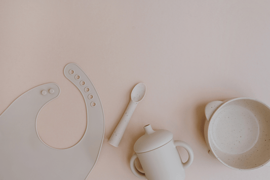 Minimal baby feeding essentials showing silicone and plastic materials for comparison in baby feeding routines