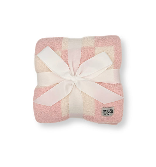 StellaMoon's Luxe Checkered Baby Blanket in a delicate shade of baby pink, illustrating its plush checkered design and soft texture.