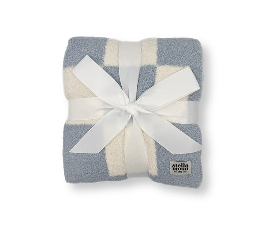 StellaMoon's Luxe Checkered Baby Blanket, capturing the serene shades of blues, showcasing its plush checkered design.