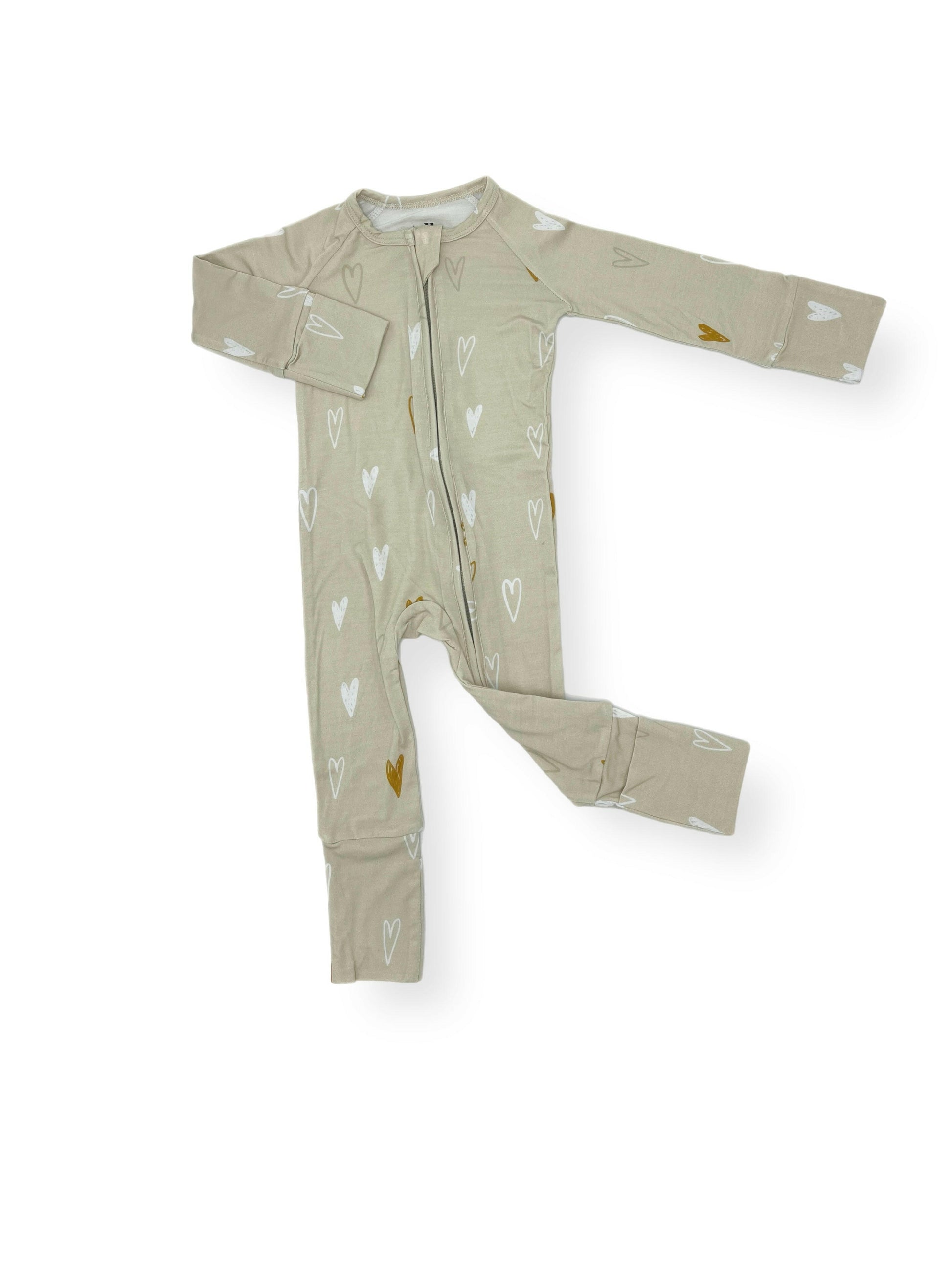 I Heart You Modal Romper featuring a beige fabric with a charming white and golden heart pattern, fold-over cuffs, and a zipper closure for easy wear.