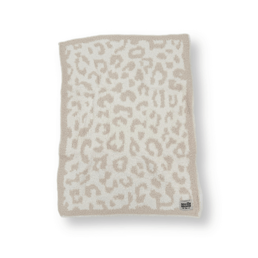 StellaMoon's Leopard Mini Blanket in soft beige, featuring a plush texture and stylish leopard pattern, ensuring comfort and safety with OEKO-TEX certification.