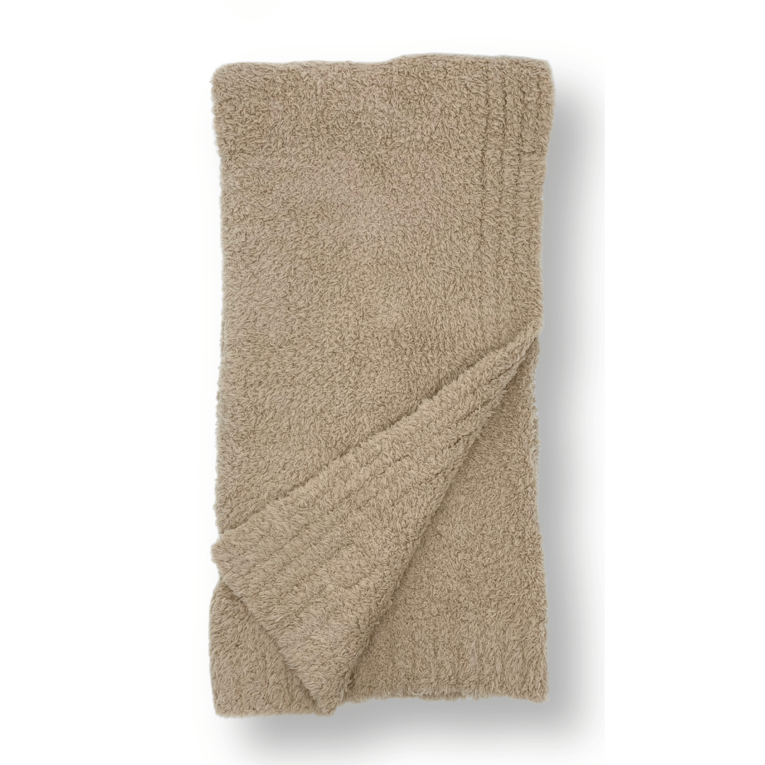 Closeup of Luxe Baby Blanket in Toffee highlighting its plush and cozy texture with Stella Moon Co. branding