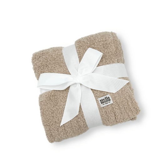 Luxe Baby Blanket in Toffee laid flat showcasing soft and textured fabric